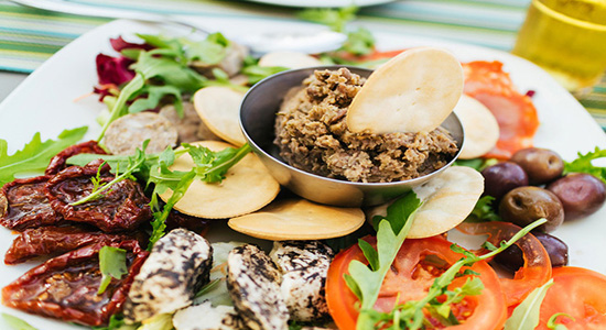 Traditional maltese appetizer with tuna, cheese and tomatoes.